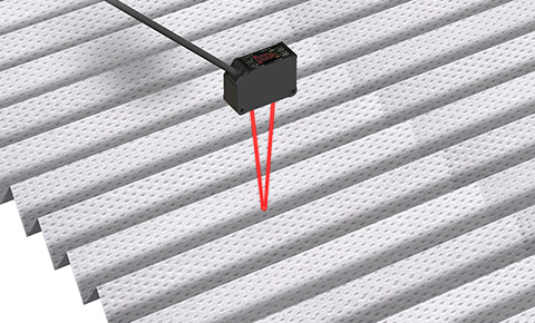 Feeding length of non-woven fabric